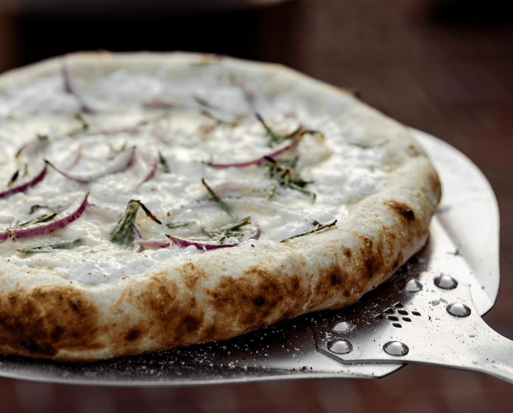 Onion, Bacon and Spinach Pizza made in a Breeo Pizza Oven