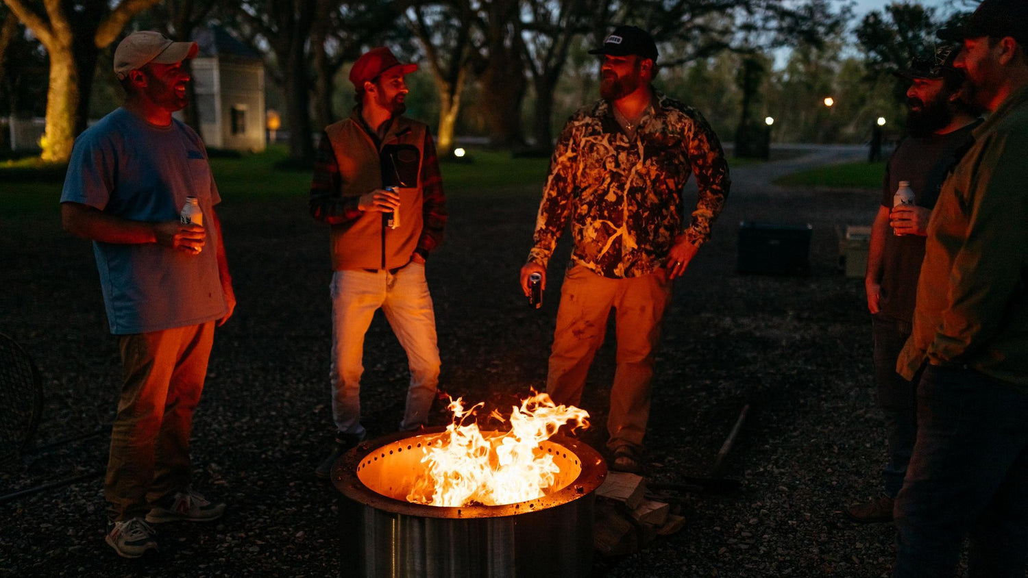 This is an image of guys hanging out around an X Series Firepit