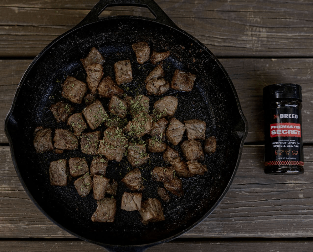 Grilled Butter Steak Bites cooked on a Breeo fire pit