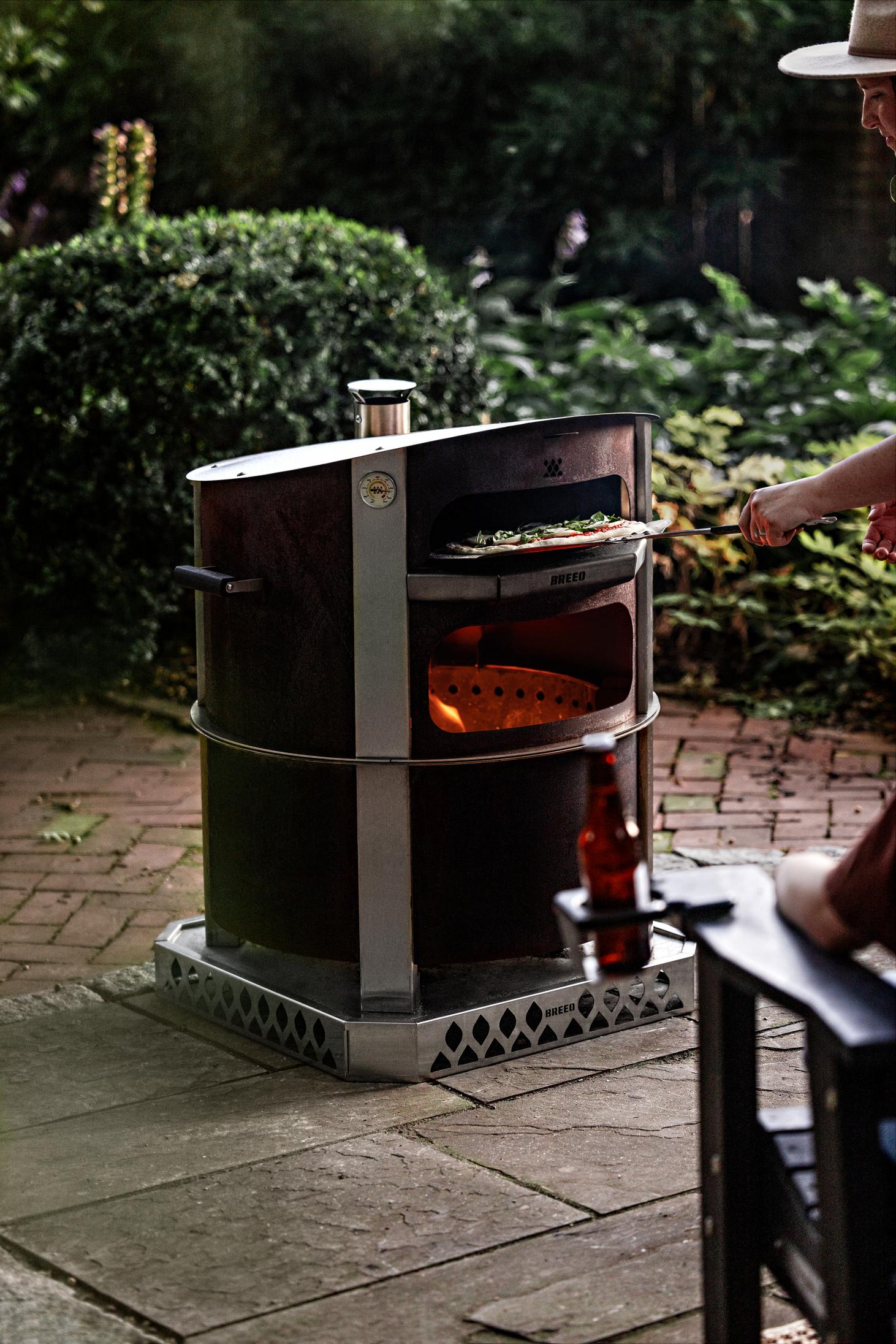This is an image of the Corten Pizza oven on an X24 fire pit
