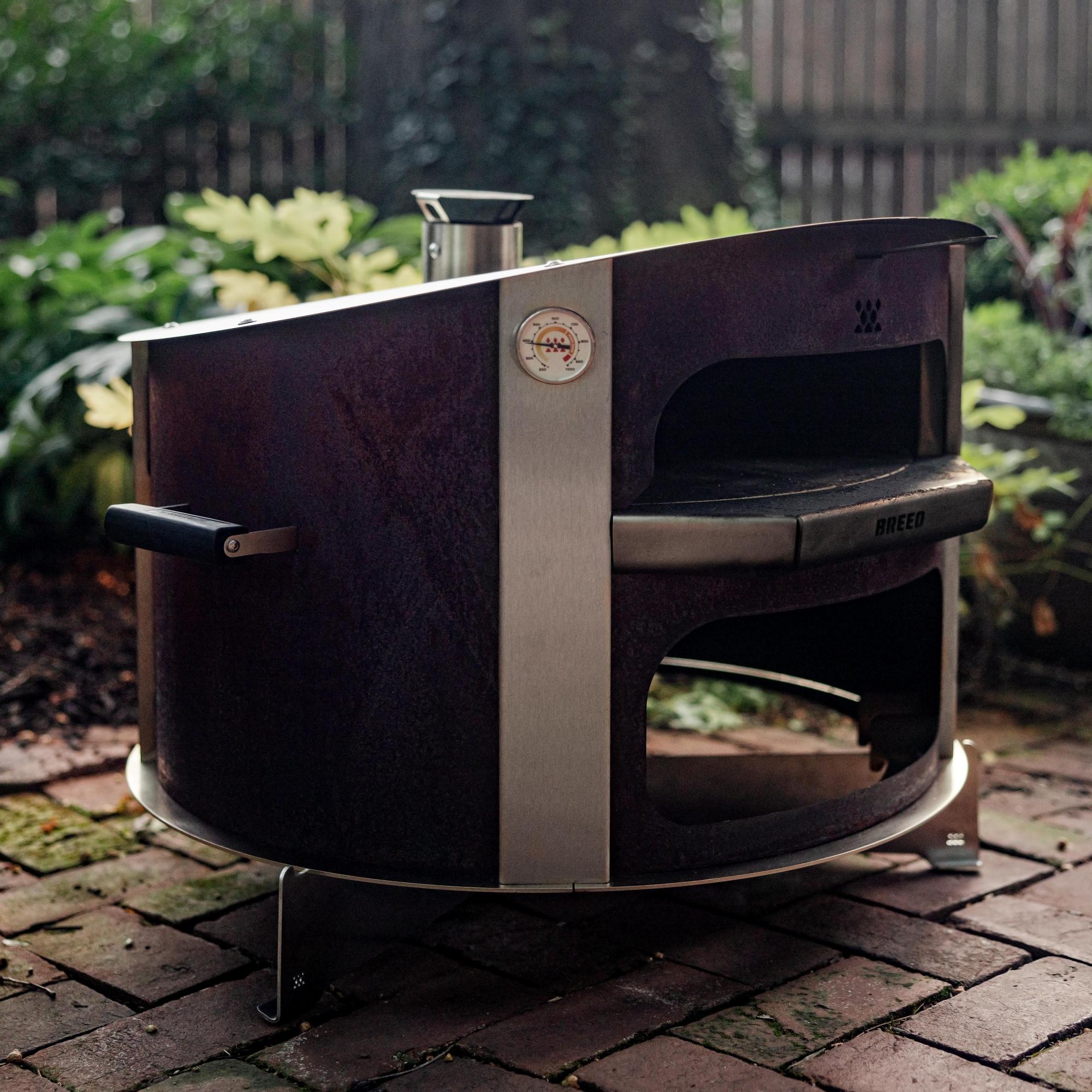 This is an image of a Breeo Pizza Oven resting on a Pizza Oven Base