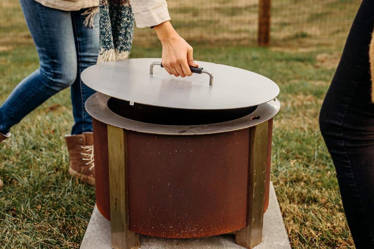 An image of an X Series Corten firepit with a lid