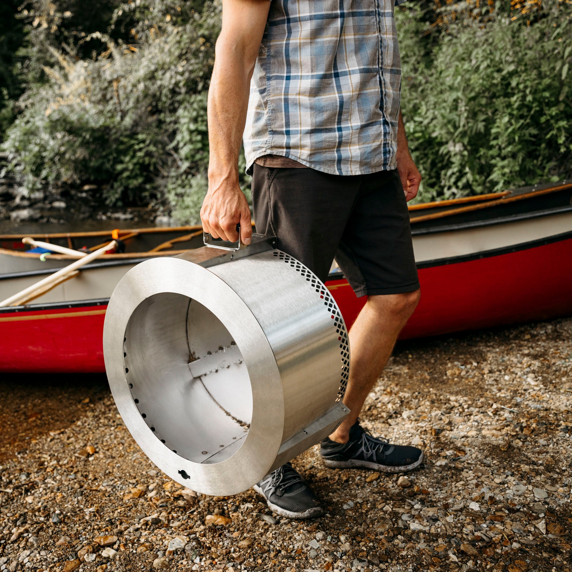person carrying breeo smokeless firepit