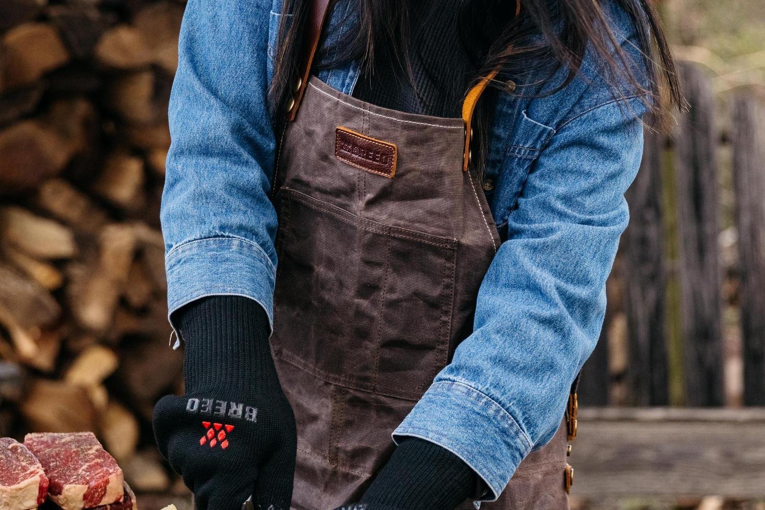 A girl wearing the Breeo Waxed Canvas Apron