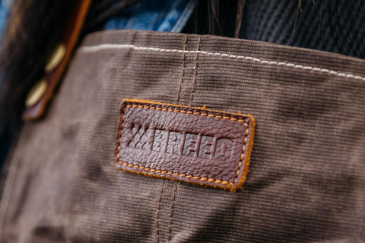 This is an image of the leather patch on the waxed canvas apron