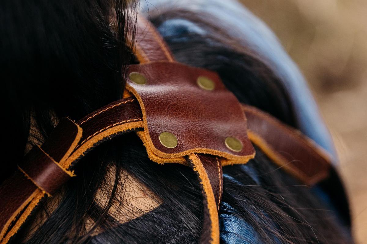 An image of the back straps on the waxed canvas apron