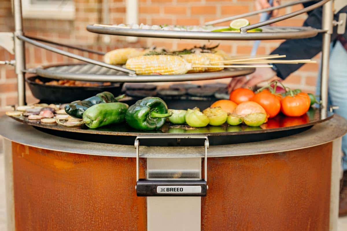 This is an image of the Breeo Searplate Griddle used in conjunction with two Outpost Griddles to cook over the X30