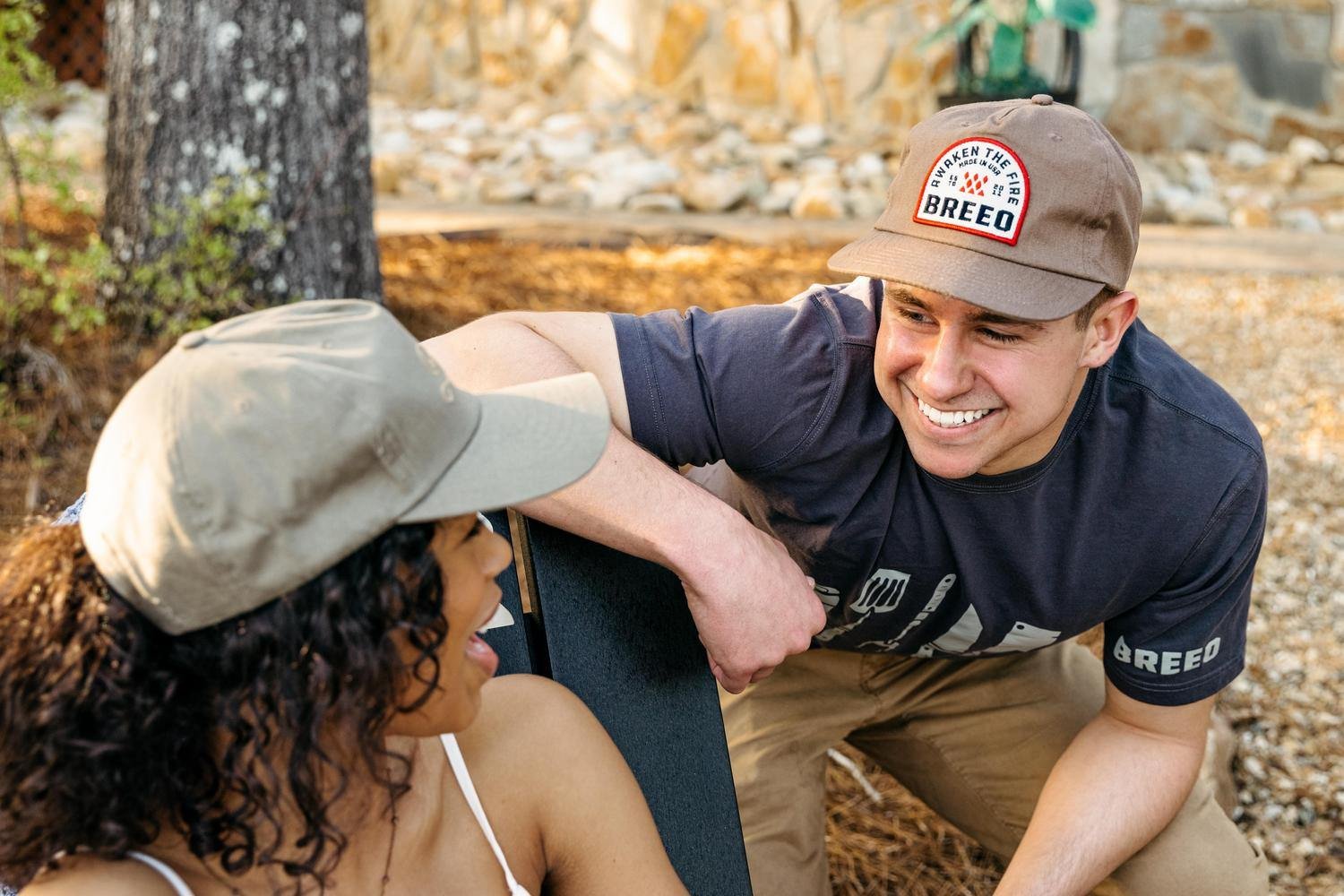 A man wearing the tan Breeo "Awaken the Fire" Hat