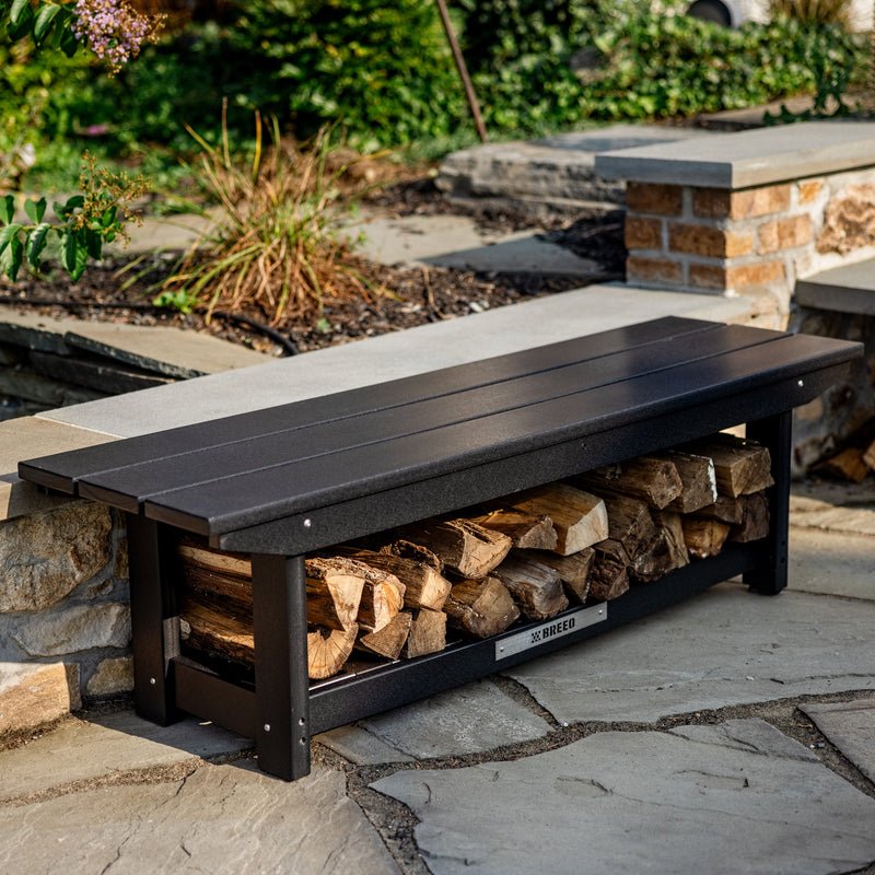 An X Series bench with wood stacked underneath