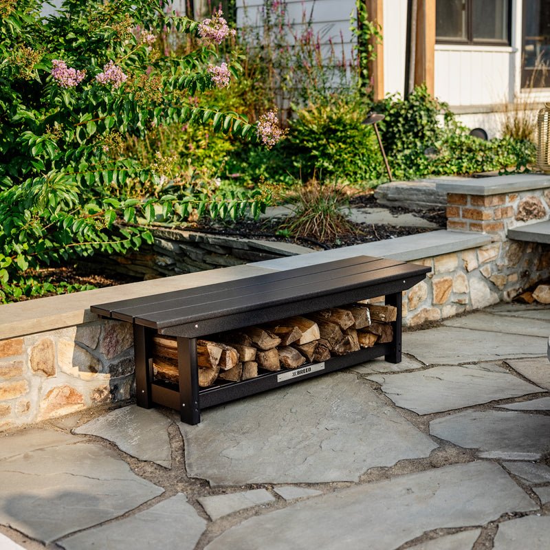 An X Series Bench with wood stacked underneath