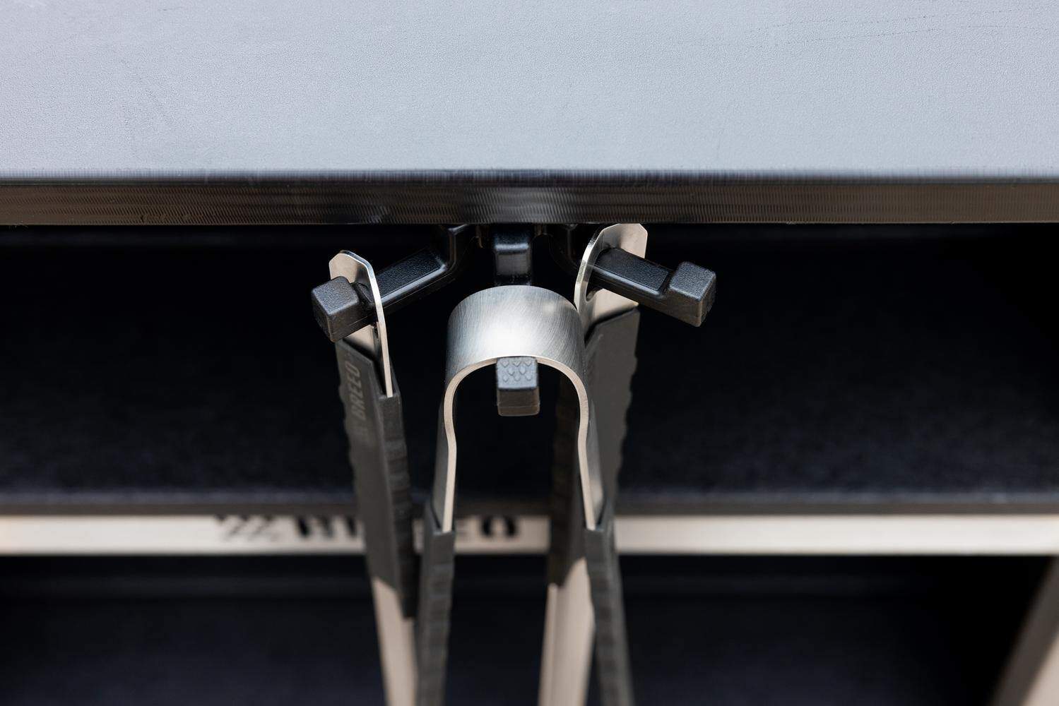 The Breeo Grilling Tools hanging from a Breeo Tri-Hook