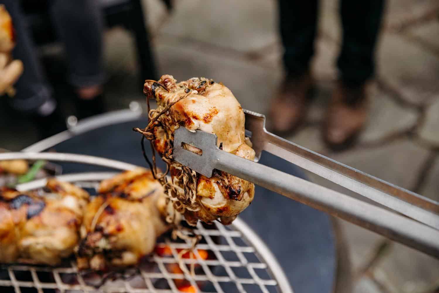 Using Breeo Tongs to flip chicken on the Outpost