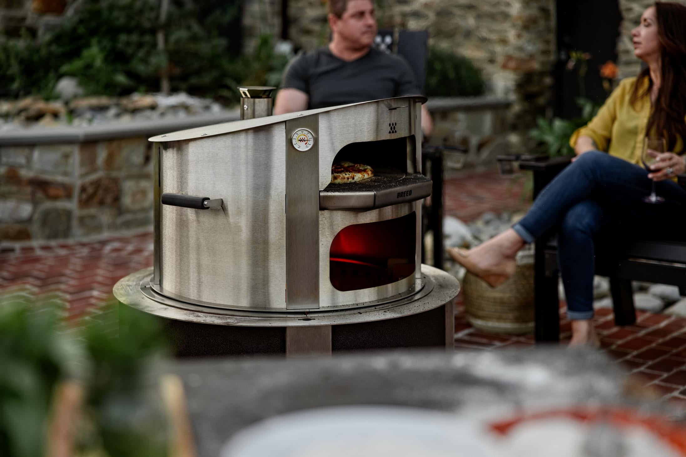This is an image of the Stainless Pizza Oven on an X30 firepit