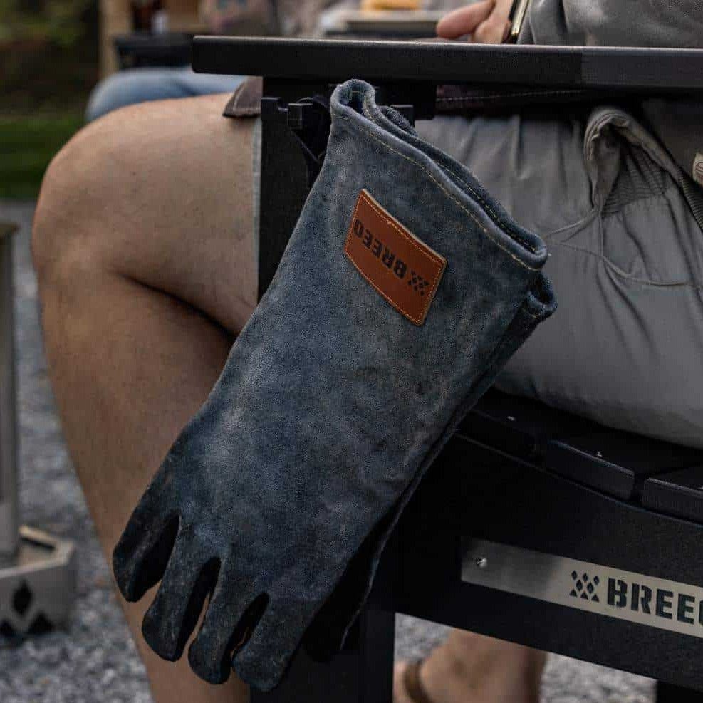 This is an image of the Outrig Tri-hook attached to an X Series Chair used to hang the leather gloves