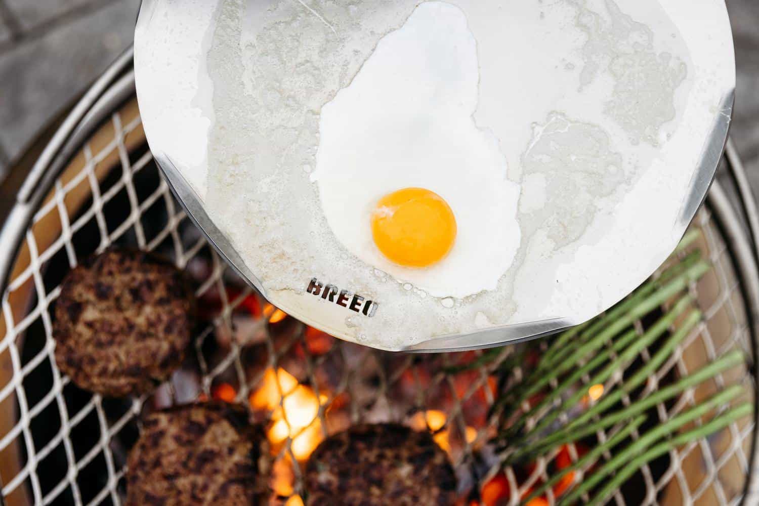 This is an image of an egg frying on a Breeo Outpost Sear Disc
