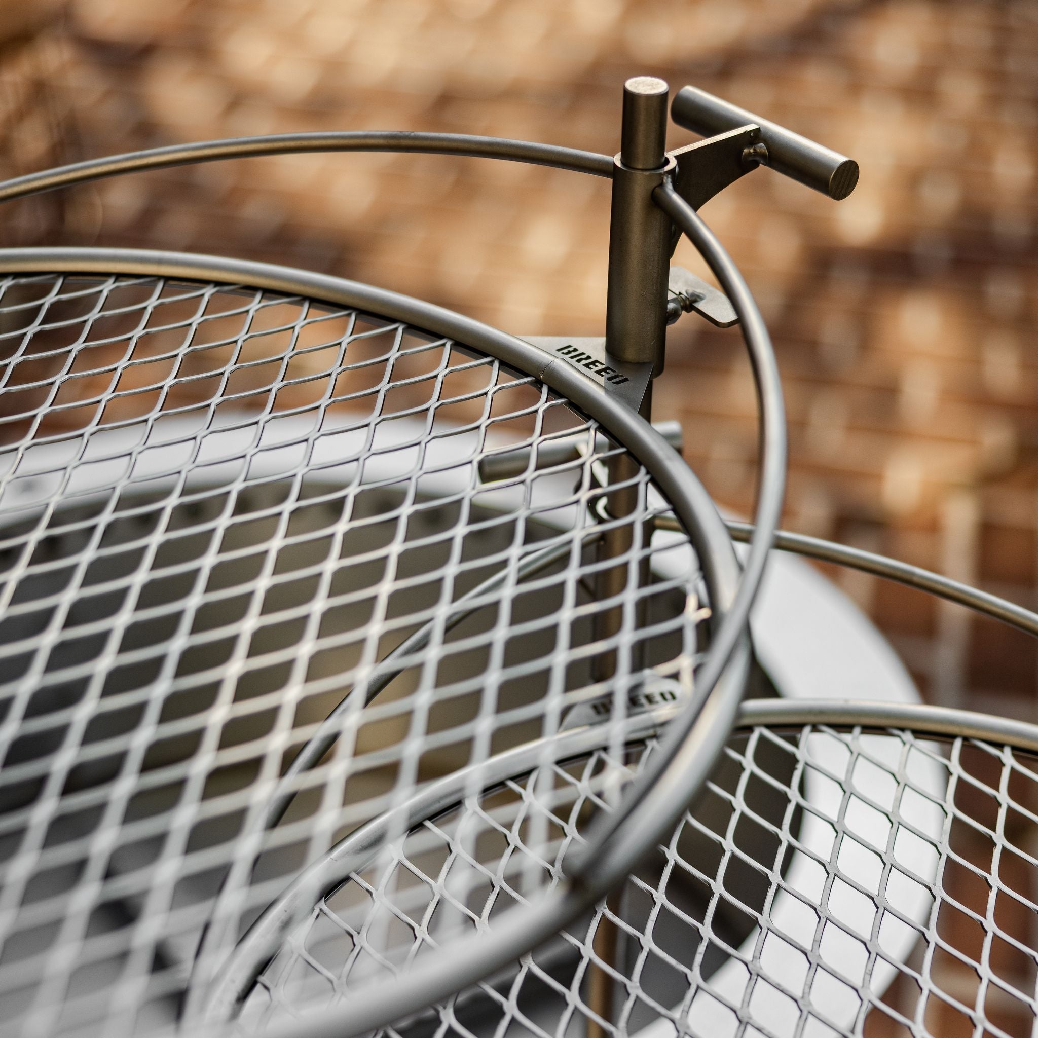 This is an image of two Outpost Grills attached to an X Series Firepit