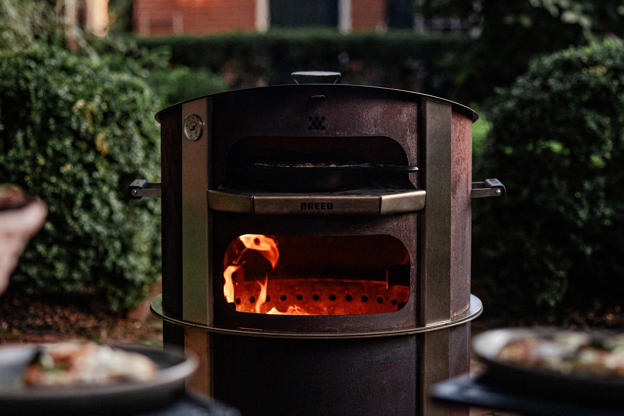 This is an image of the Corten Pizza oven on an X24 fire pit
