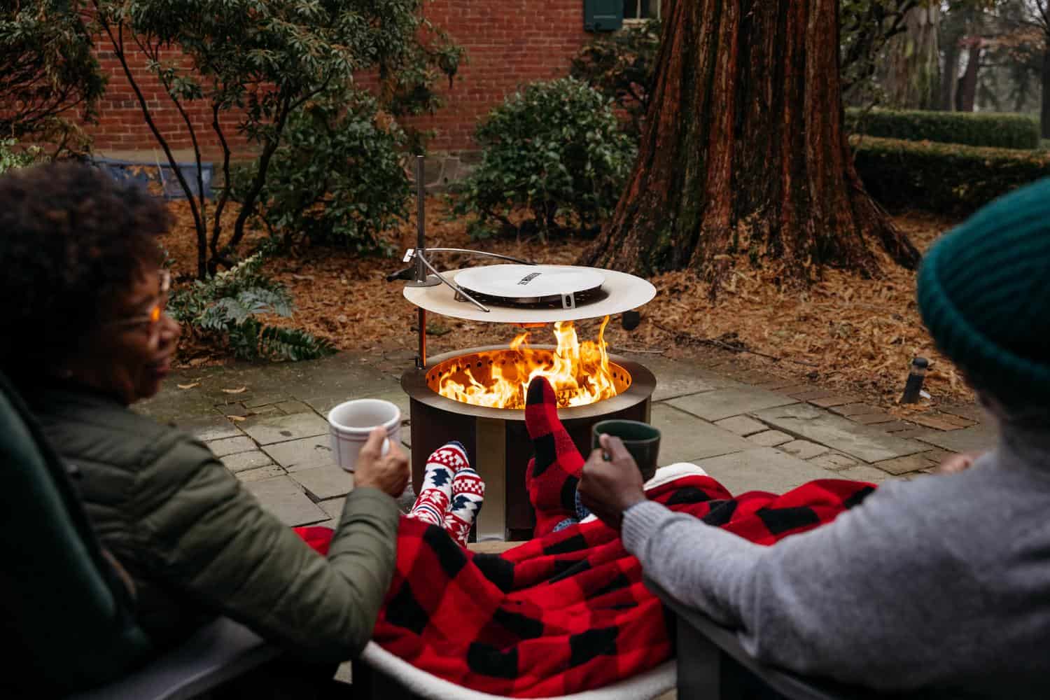 Cozy winter scene with Heat Deflector 24 on a X Series firepit