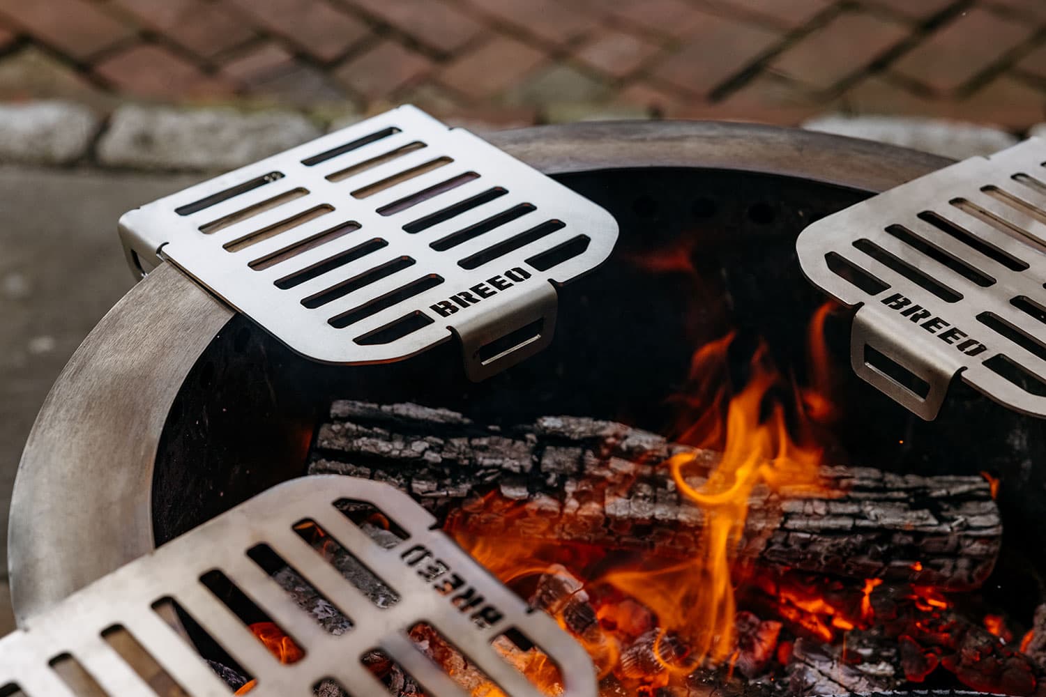 Three Breeo Skillet Rests attached to a Breeo X30 Firepit