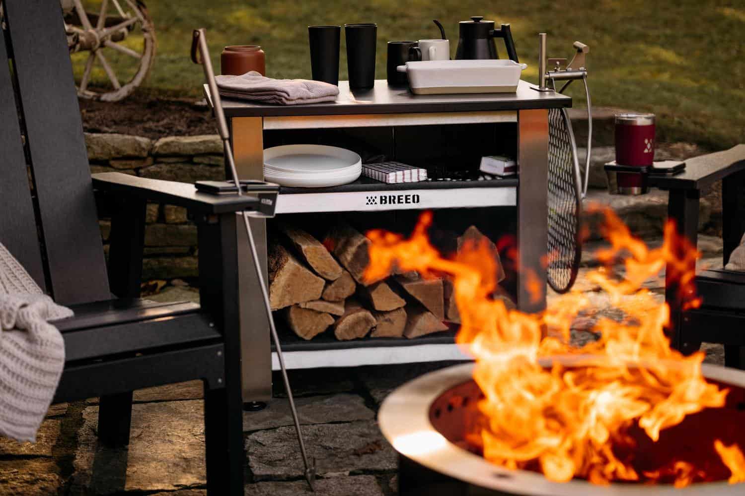 This is an image of the Breeo X Series Table set up with an X Series firepit and chairs.