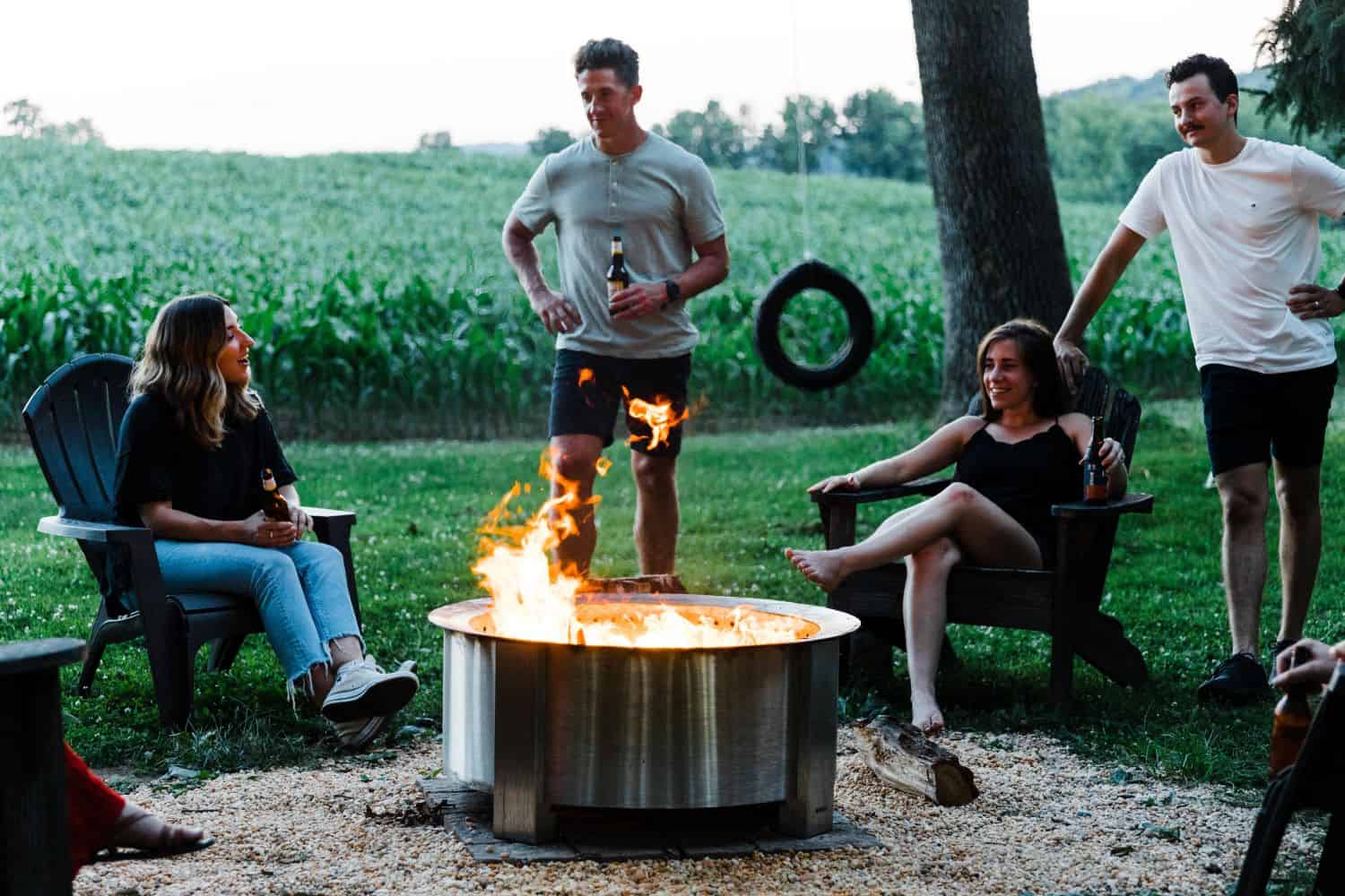 X30 Stainless firepit with friends gathered around it