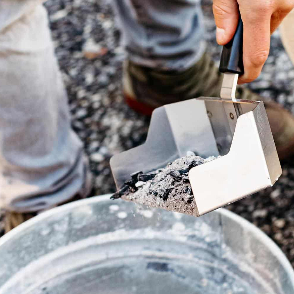 Removing ash with a Breeo Ash Shovel