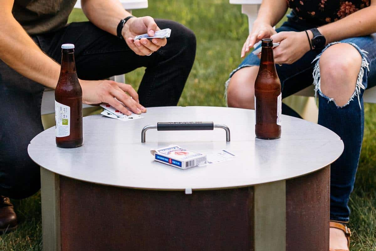 Playing a card game on the lid of an X Series firepit