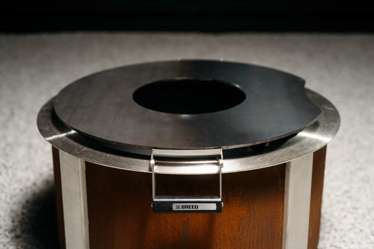 This is an image of the Breeo Searplate Griddle on an X Series Firepit