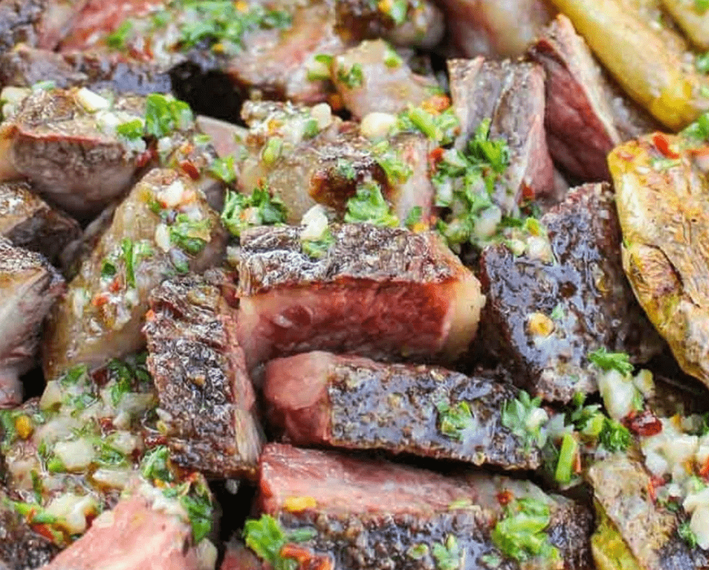 Grilled Beef Short Ribs & Chimichurri Butter by Derek Wolf made with a Breeo Fire pit