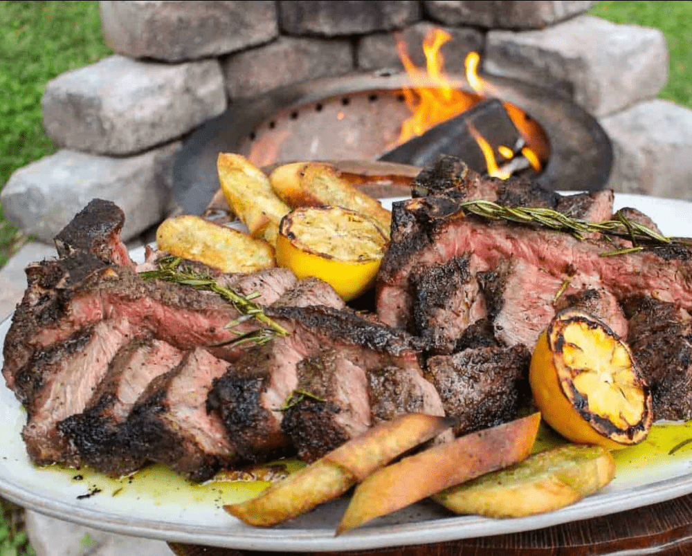 Steak with Garlic Confit by Derek Wolf cooked on a Breeo Firepit