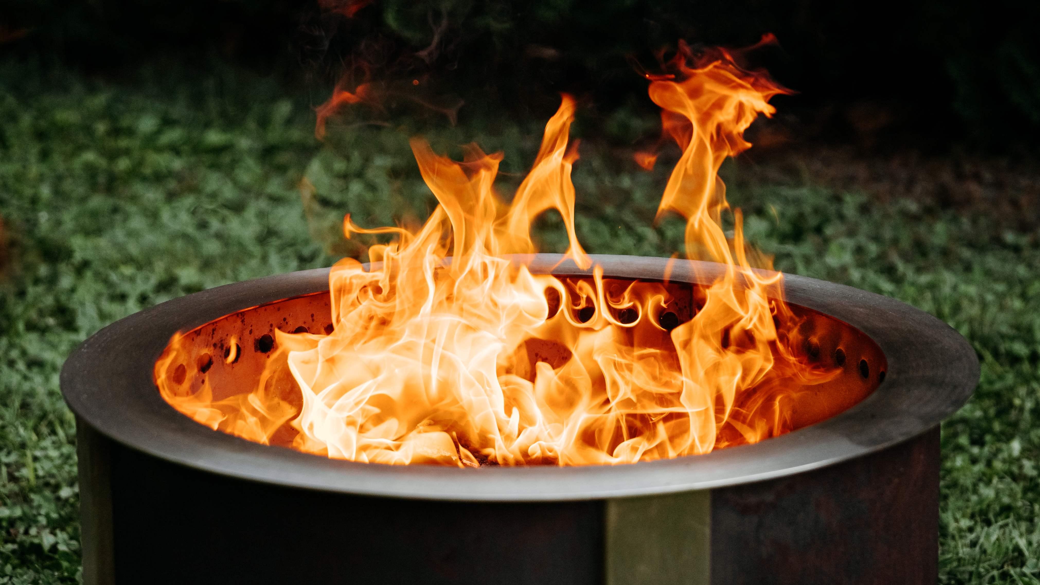 An image of flames coming out of the X Series Corten firepit