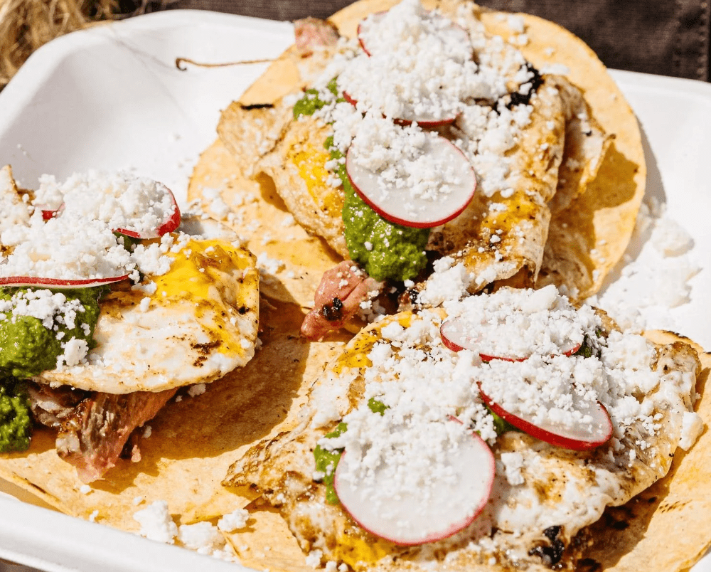 Steak & Egg Breakfast Tacos grilled on a Breeo fire pit