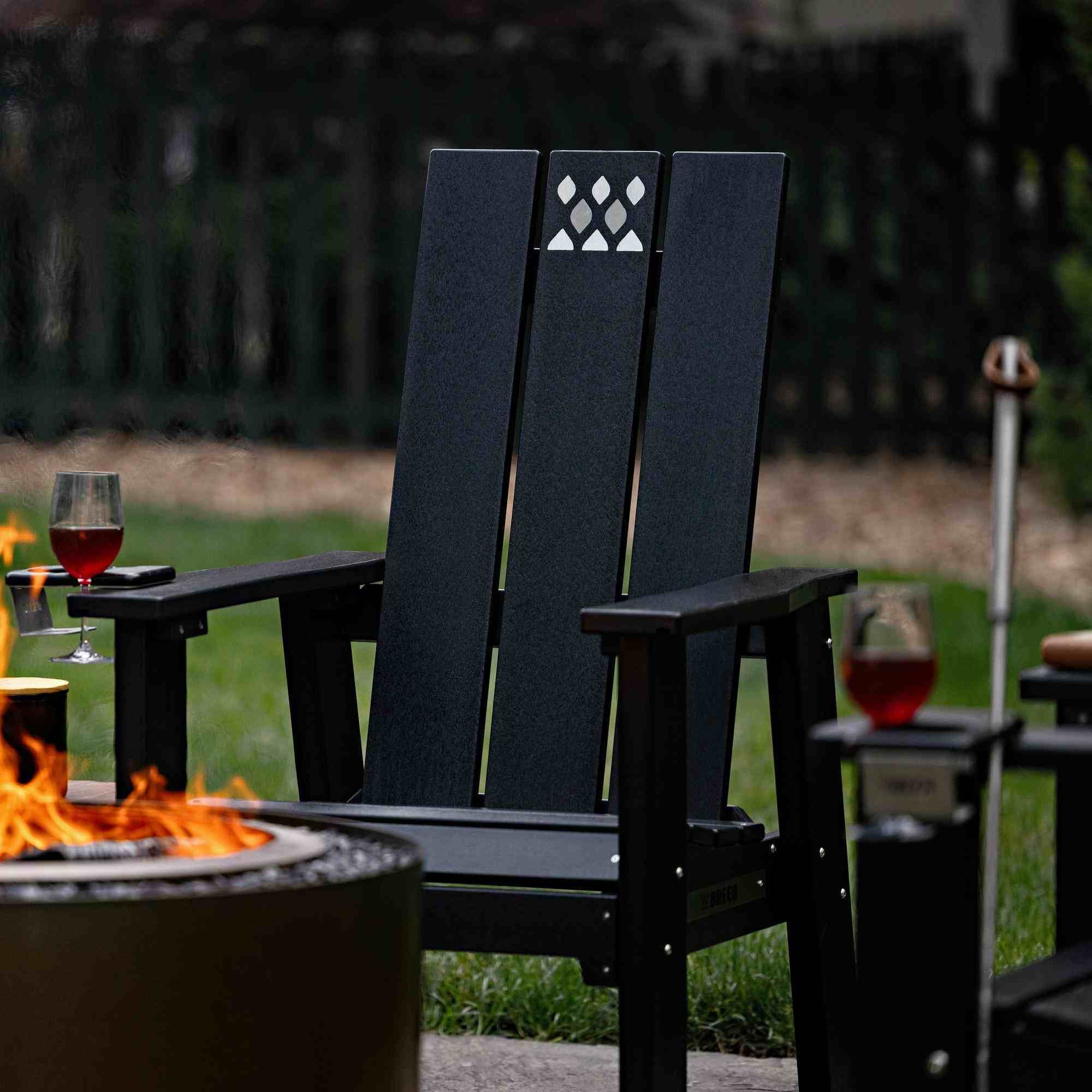 An image of an X Series Chair next to a Luxeve Firepit