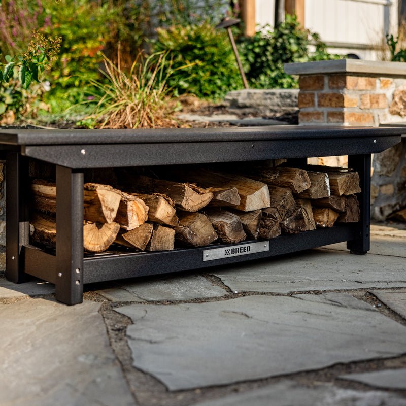 An X Series bench with wood stacked underneath