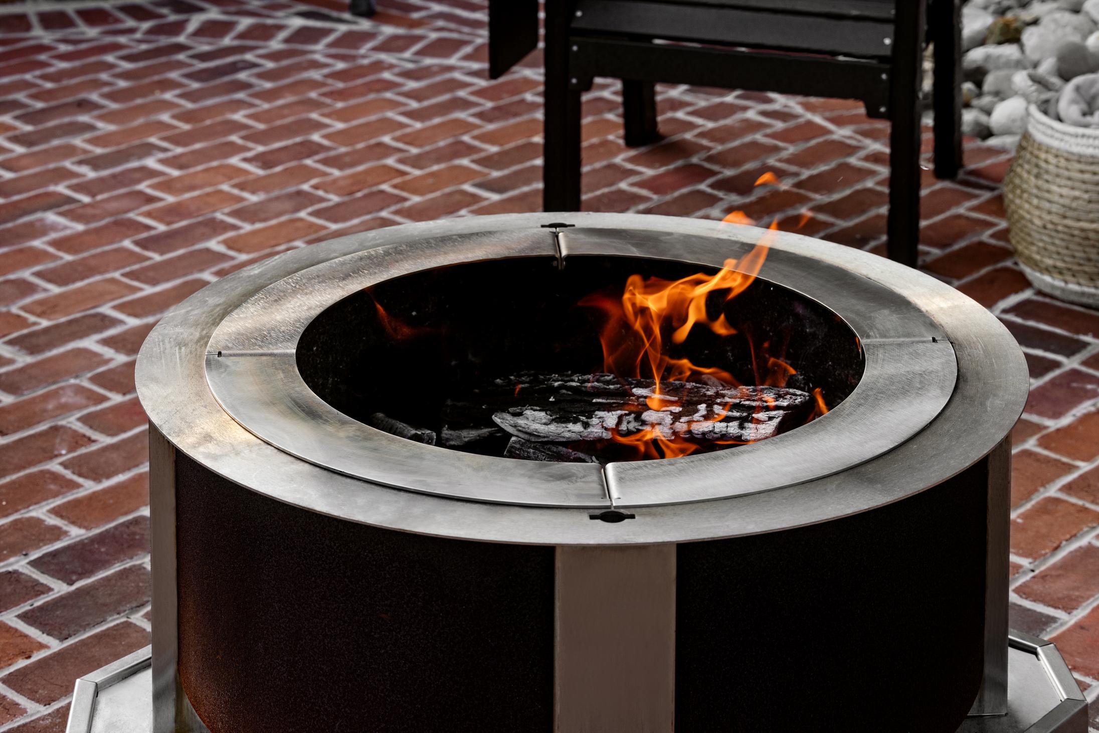 This is an image of the Breeo Pizza Oven Adapter on an X30 firepit