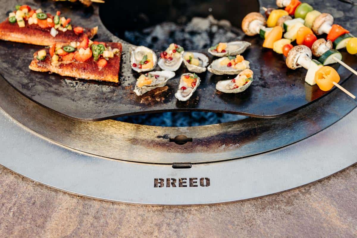 This is a close up image of food grilling on the Searplate Griddle