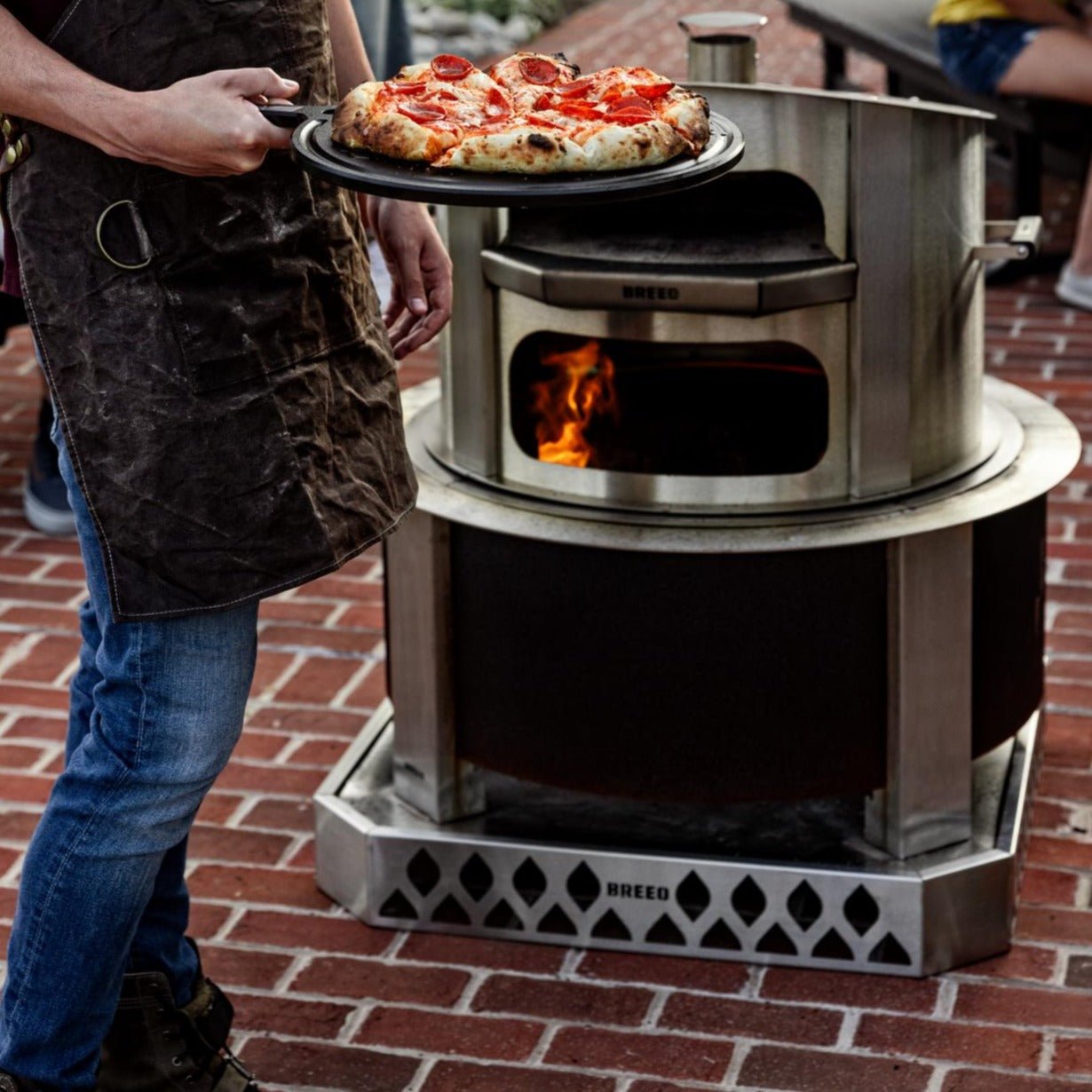 This is an image of pizza ready to serve on a Serving Board