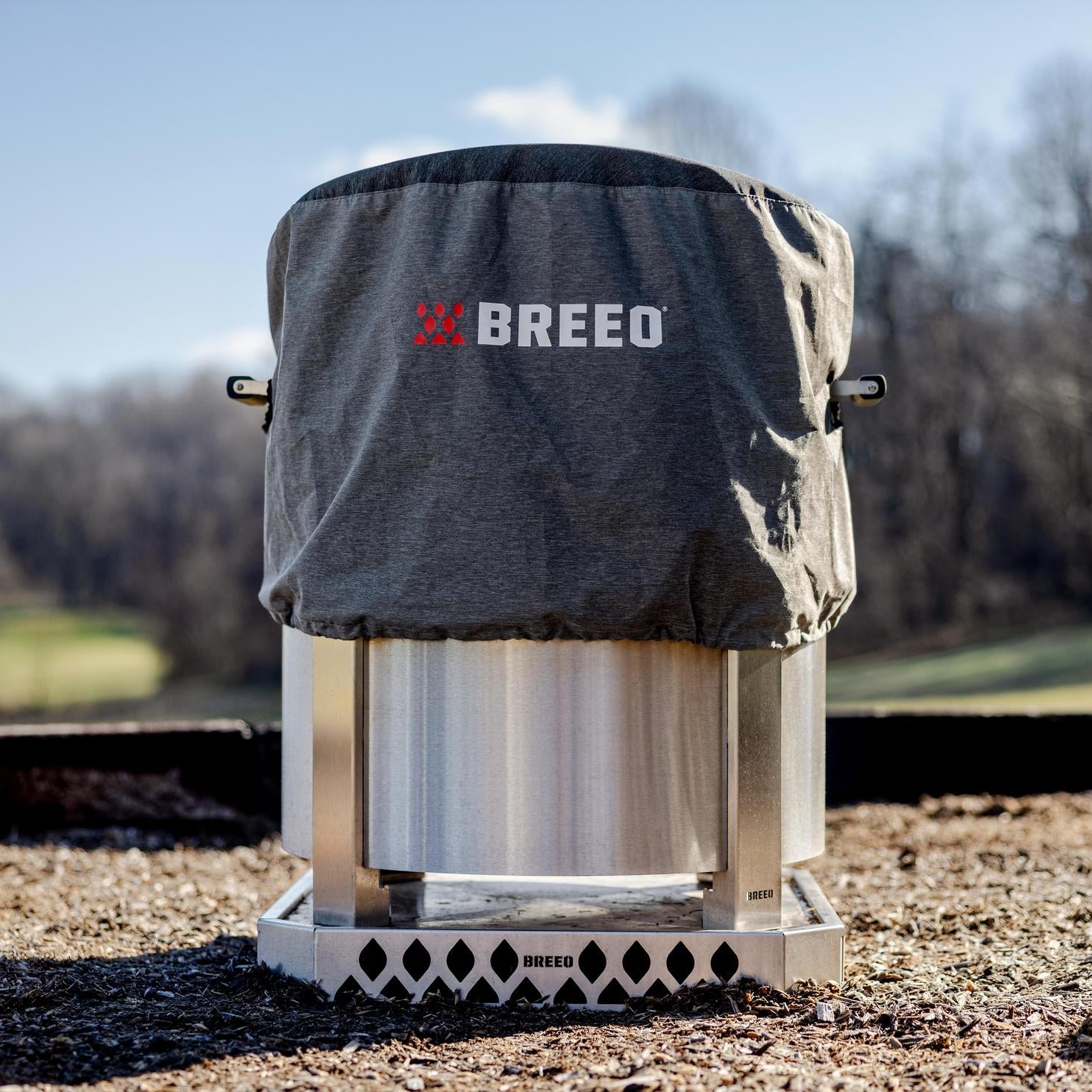 This is an image of the X24 Stainless Firepit with Pizza Oven and a Pizza Oven Cover.