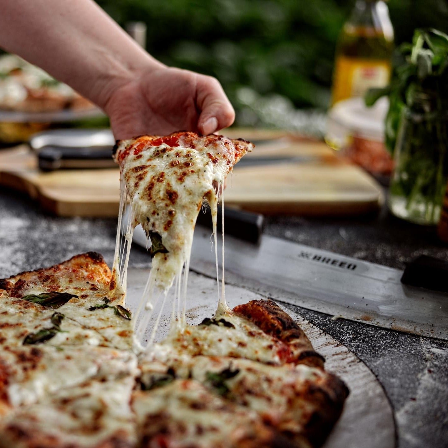 This is an image of pizza freshly baked from a pizza oven