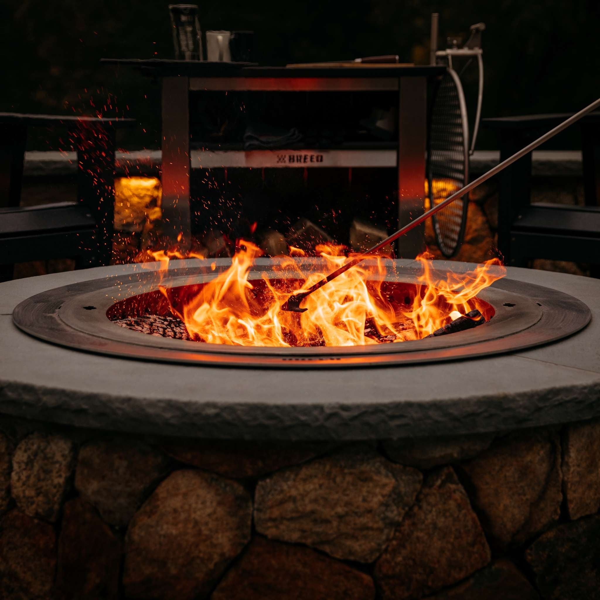 This is an image of the X30 firepit installed in a stone surround with the Insert Ring