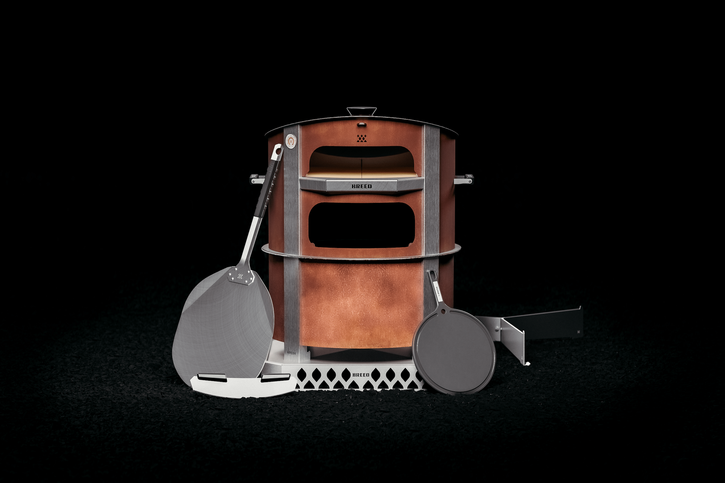 This is an image of the Live Fire Pizza Oven Bundle including the X24 Corten firepit, Corten Pizza Oven, Pizza Peel, Serving Board, Pizza Rocker, Breeo Base, and Pizza Oven Base.