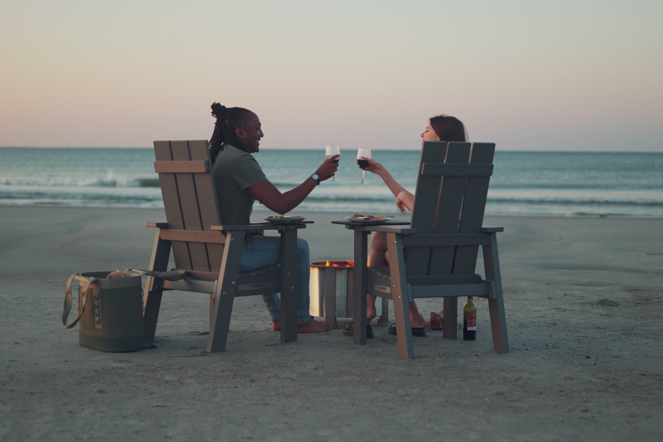 A montage video of users sitting in X Series chairs, enjoying fires and the furniture accessories attached to the chairs.